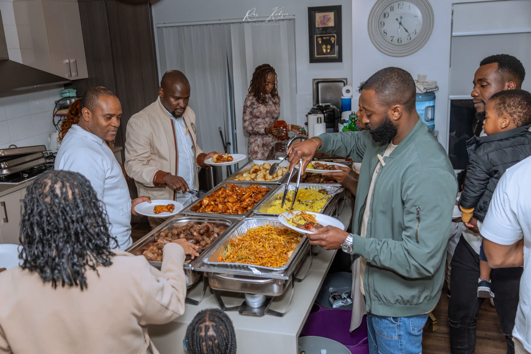 Guests sharing food around the celebration buffet