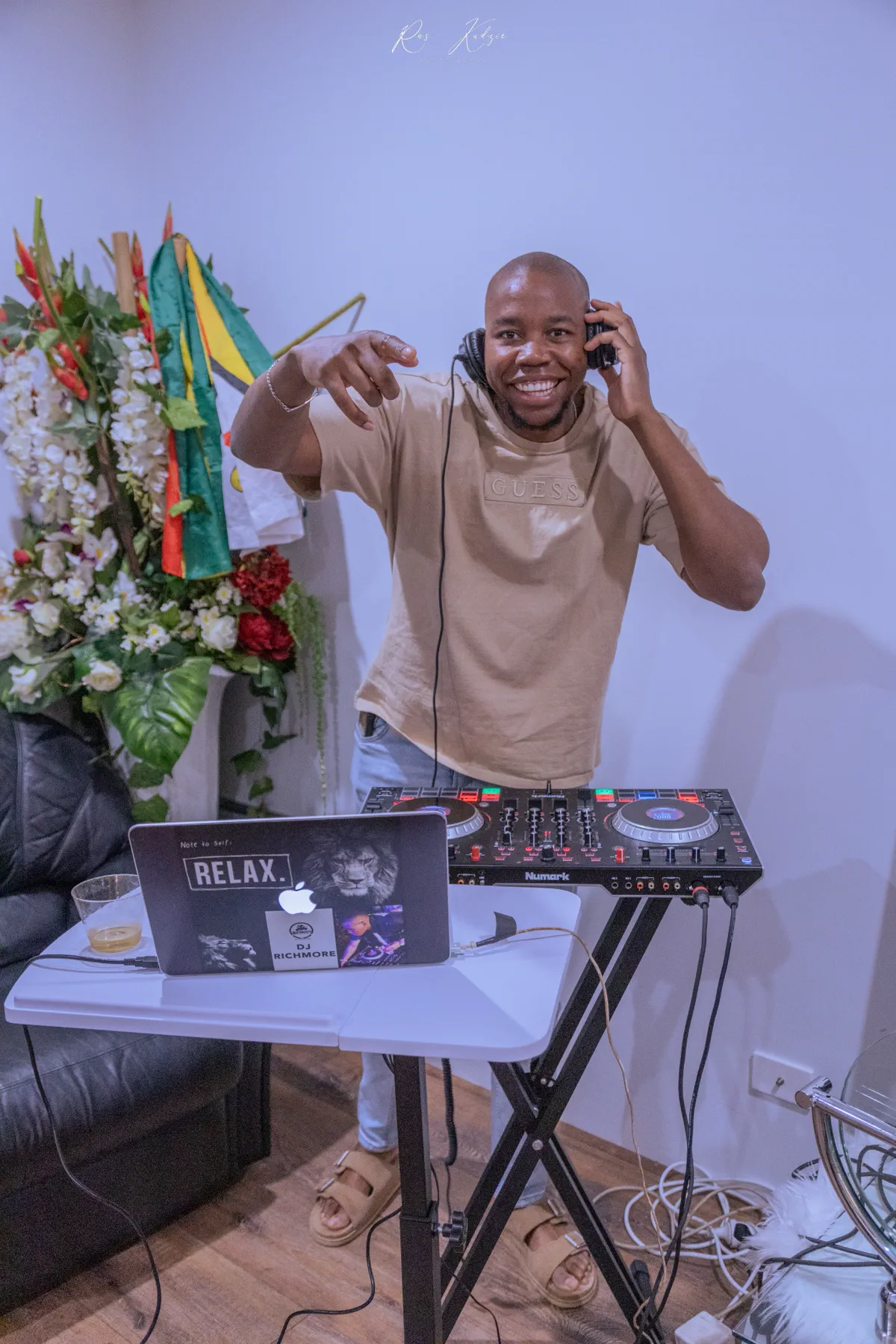 Smiling DJ performing at the celebration