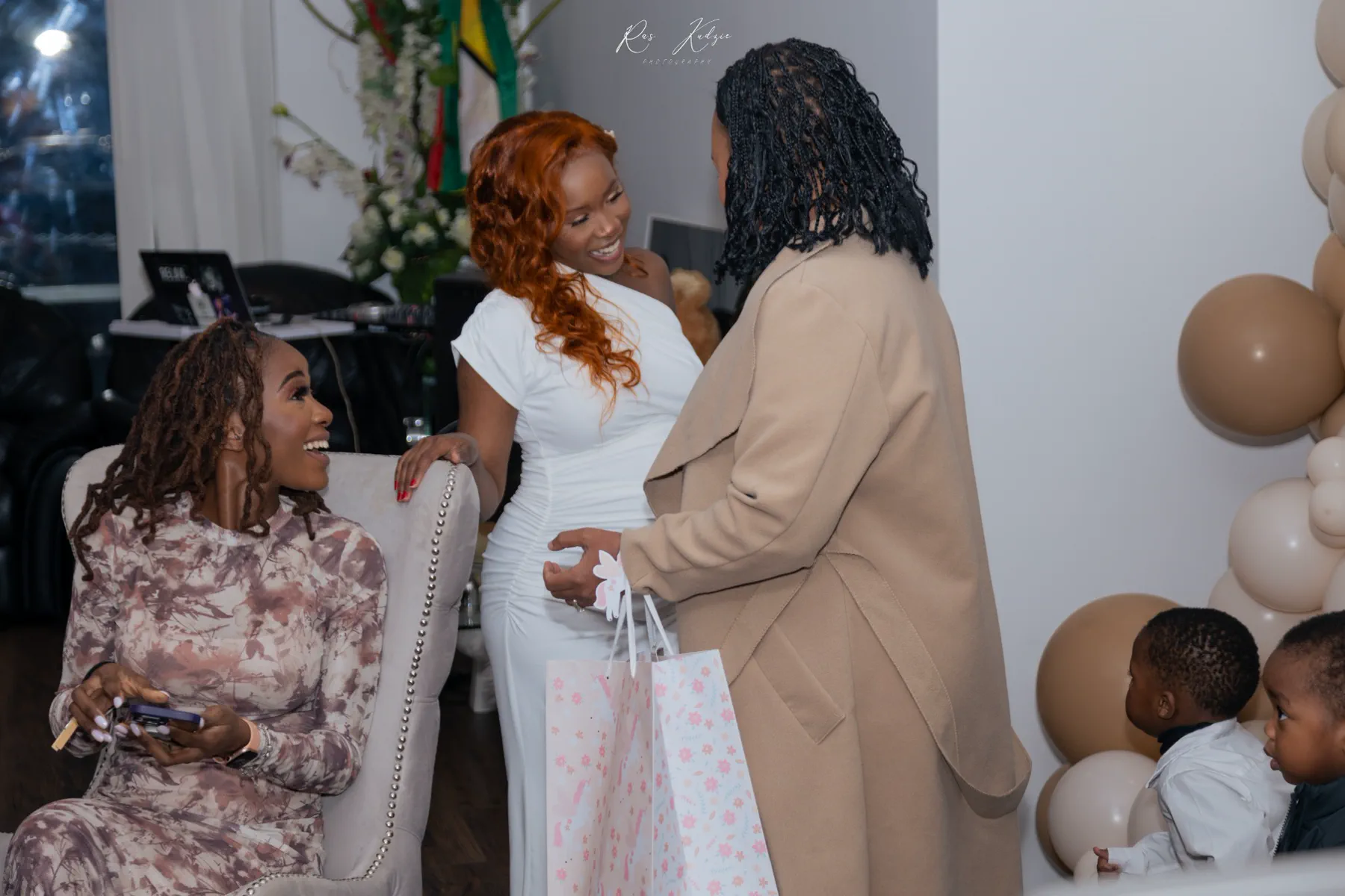 Friends sharing a joyful candid moment during the celebration
