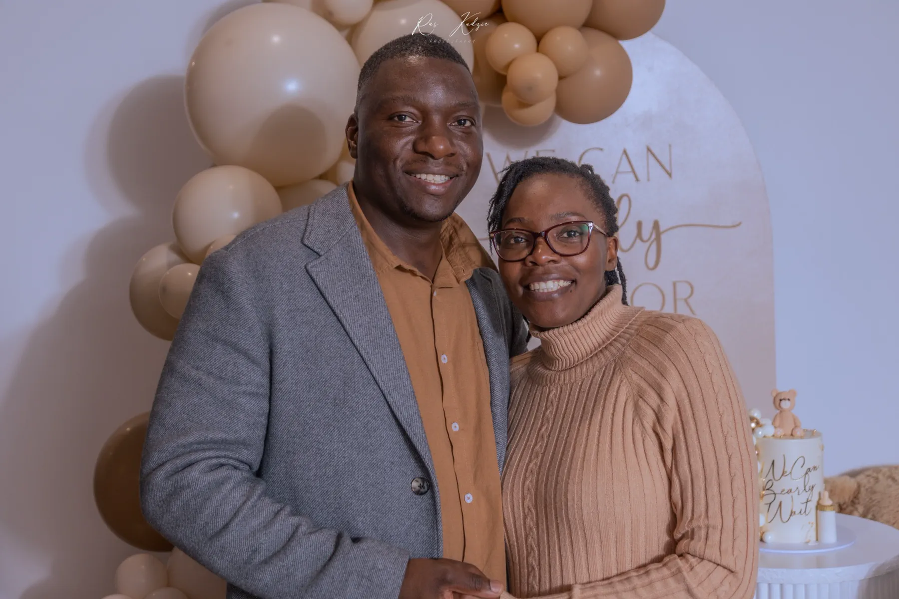 A smiling couple photographed at the celebration