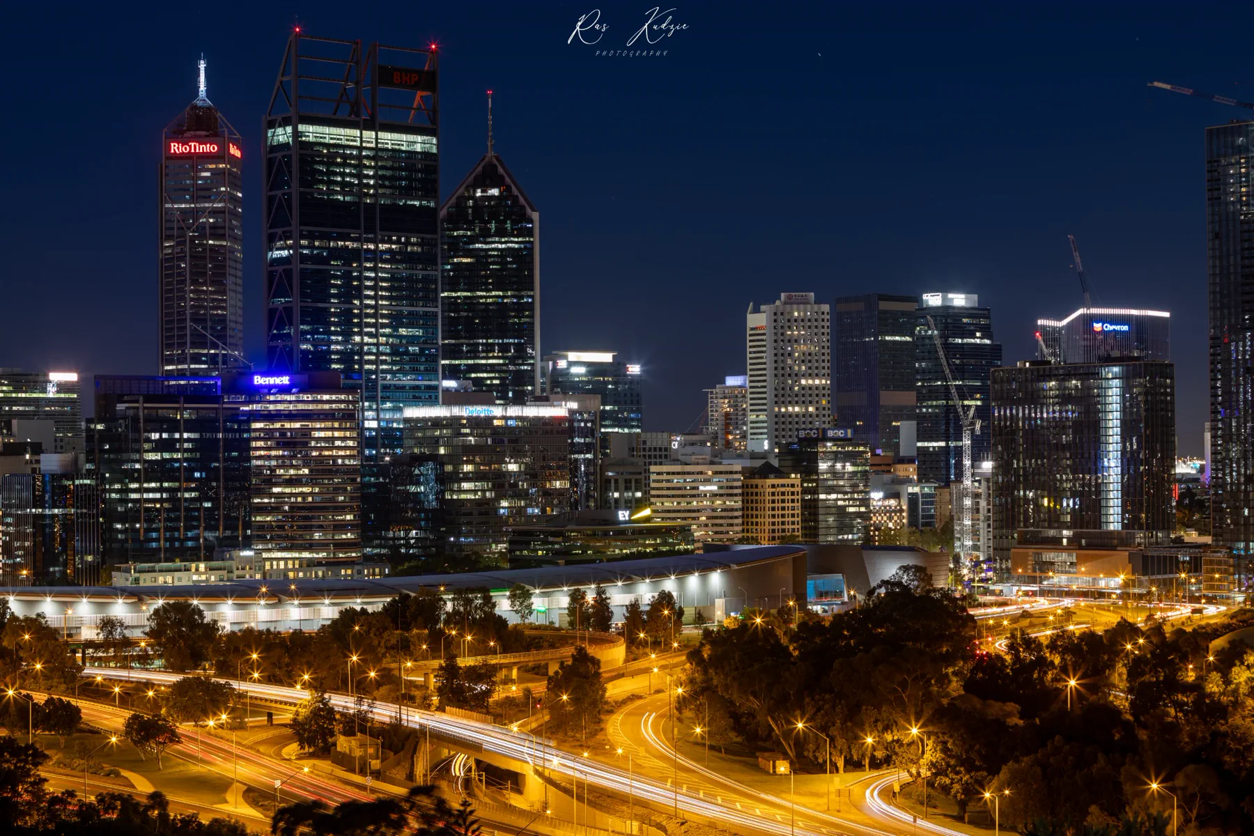 Perth city skyline illuminated against a deep blue night sky